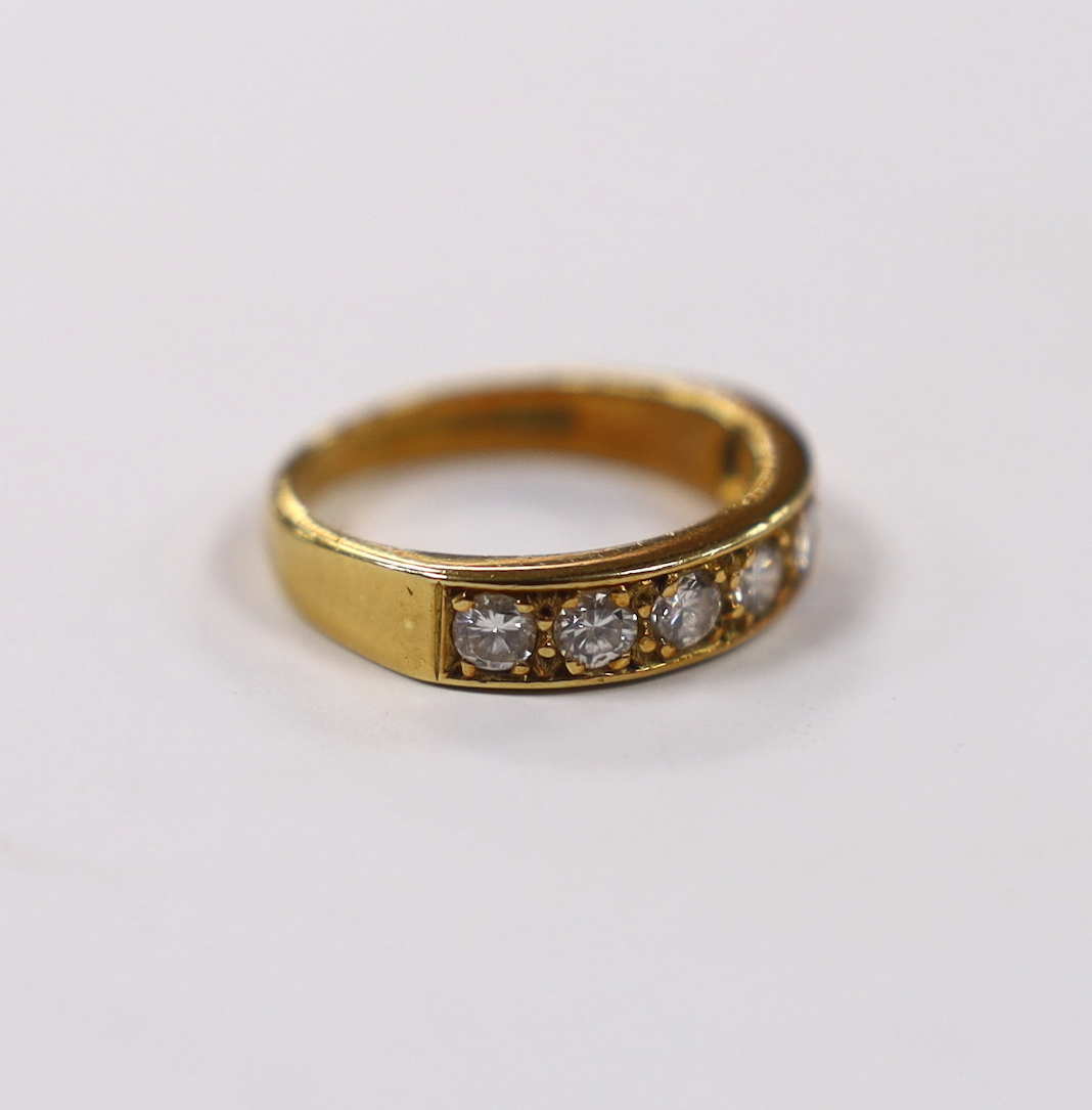 A modern 18ct gold and seven stone diamond set half hoop ring, size L, gross weight 4.3 grams.